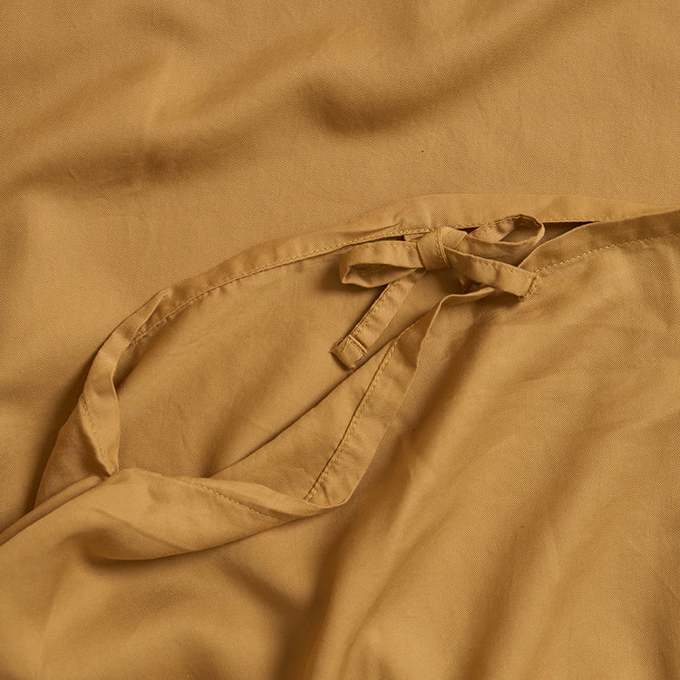 Sluiting van TENCEL™ dekbedovertrek in Okergeel 