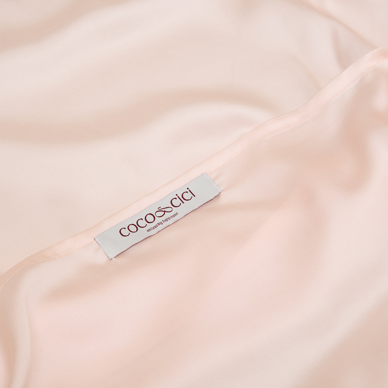 Sluiting van TENCEL™ Sateen kussensloop in Perzik Wit 
