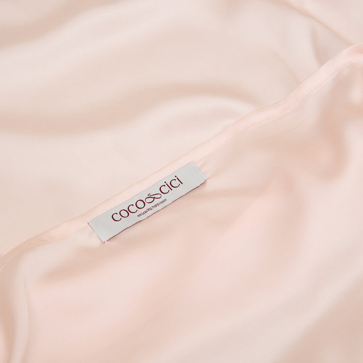 Sluiting van TENCEL™ Sateen kussensloop in Perzik Wit 