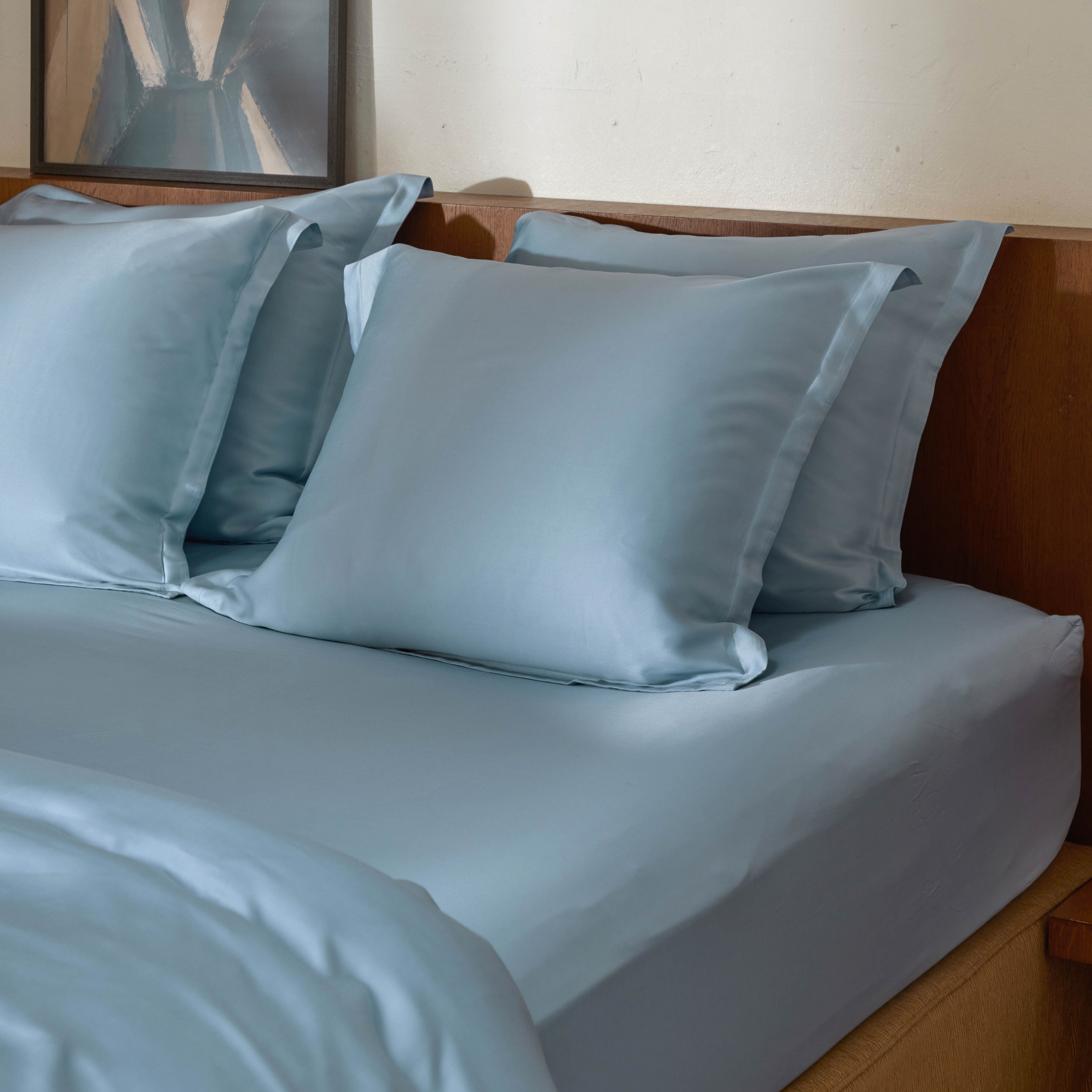 Jeans Blue hoeslaken om matras met kussenslopen erop