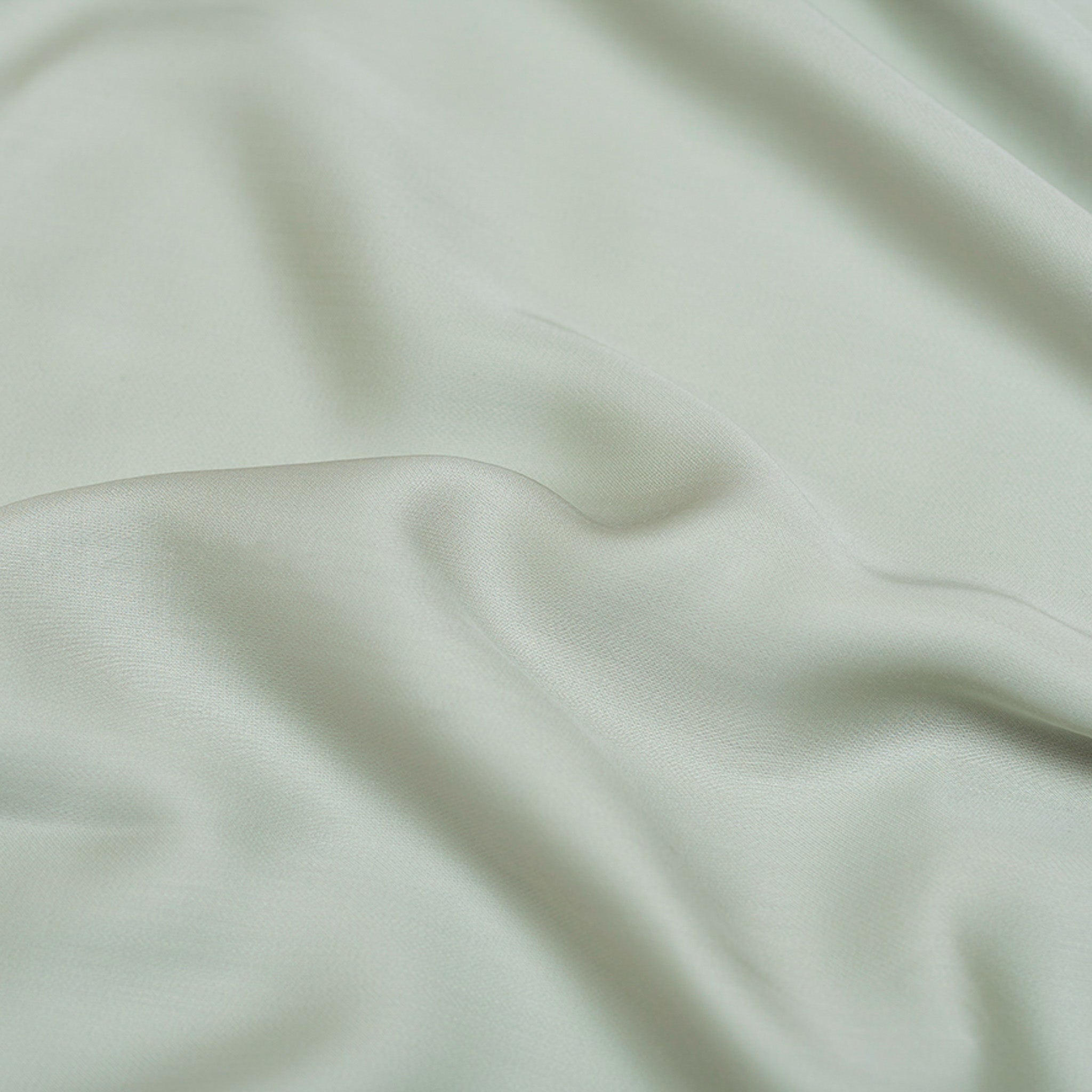 Tencel groen grijs hoeslaken detail foto van de zachte stof