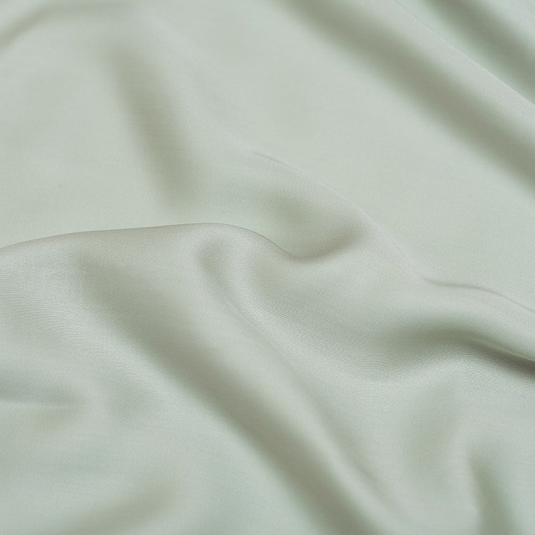 Tencel groen grijs hoeslaken detail foto van de zachte stof